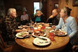 Photo of tasters conferring about food